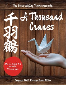a hand holds an origami crane